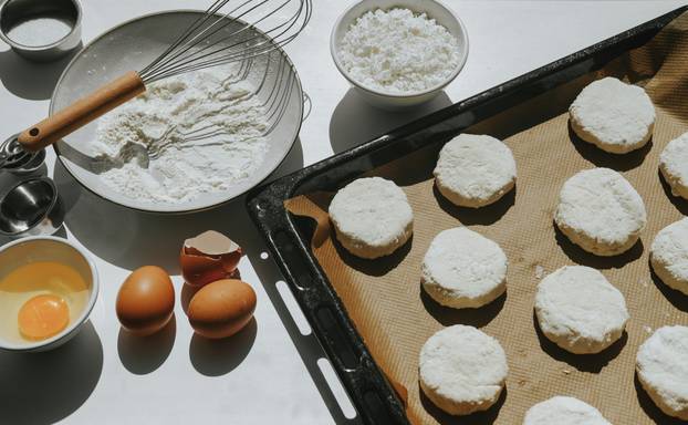 The process of making curd cheesecakes. Cheesecakes on a baking sheet