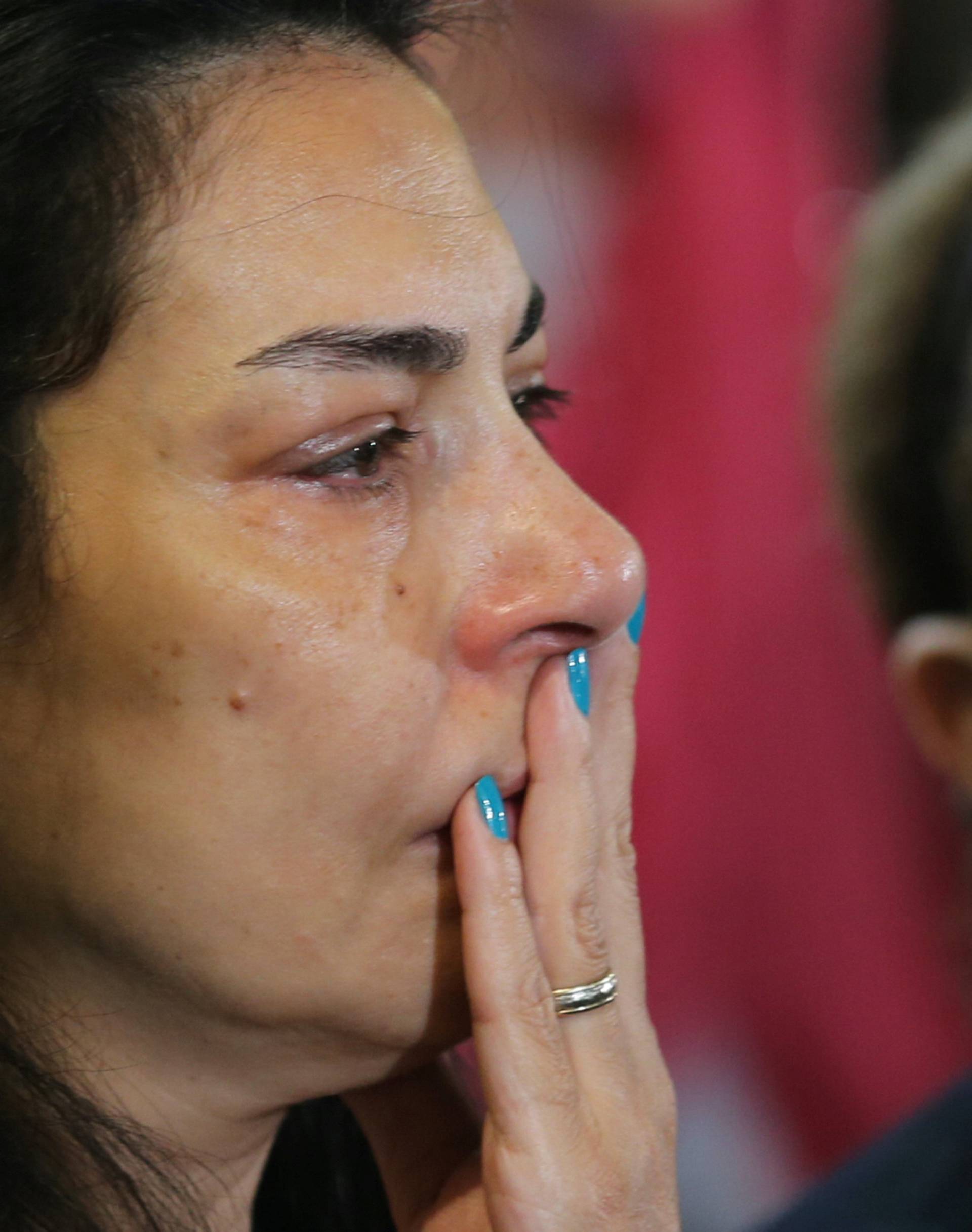 Relatives of the Christian victims of the crashed EgyptAir flight MS804 react during an absentee funeral mass at the main Cathedral in Cairo