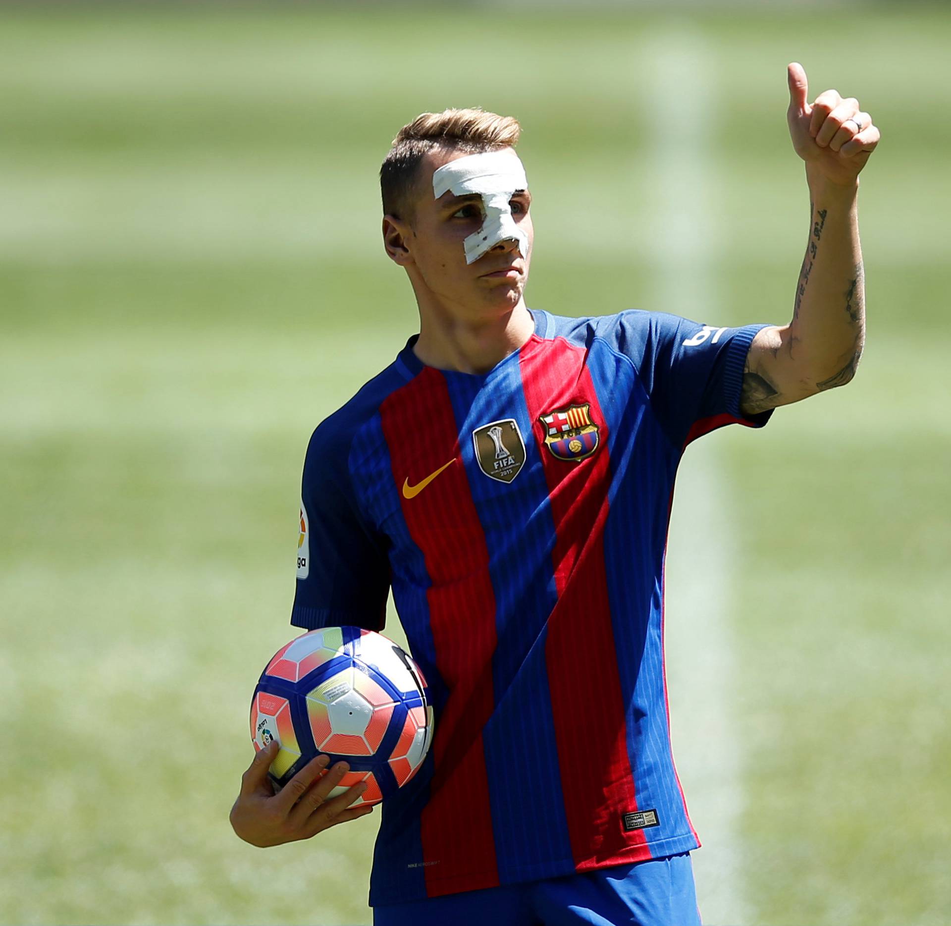 FC Barcelona's newly signed soccer player Lucas Digne gestures during his presentation at Camp Nou stadium in Barcelona