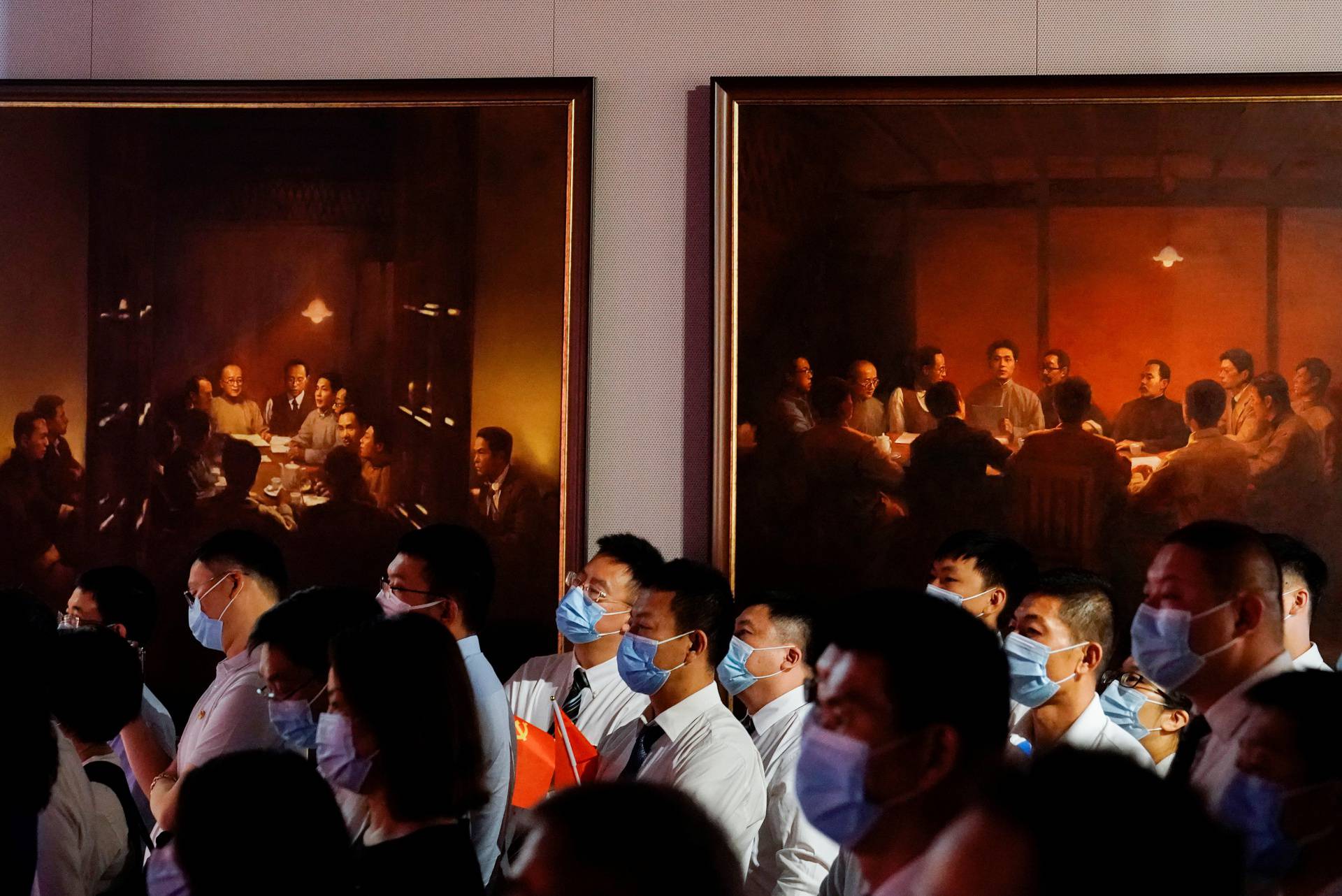 People attend an event marking the 100th founding anniversary of the Communist Party of China, in Shanghai