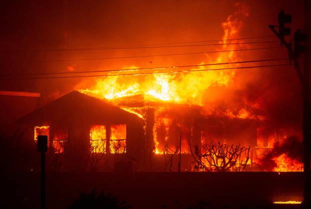 Palisades Fire burns during a windstorm on the west side of Los Angeles