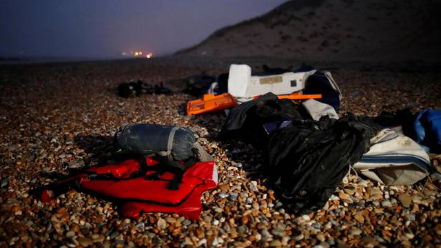 Migrant dinghy heads off the French coast to cross the English channel