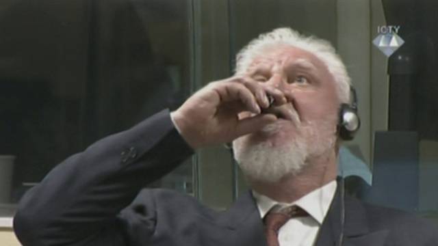 A wartime commander of Bosnian Croat forces, Slobodan Praljak, is seen during a hearing at the U.N. war crimes tribunal in the Hague