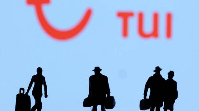 Figurines are seen in front of Tui logo