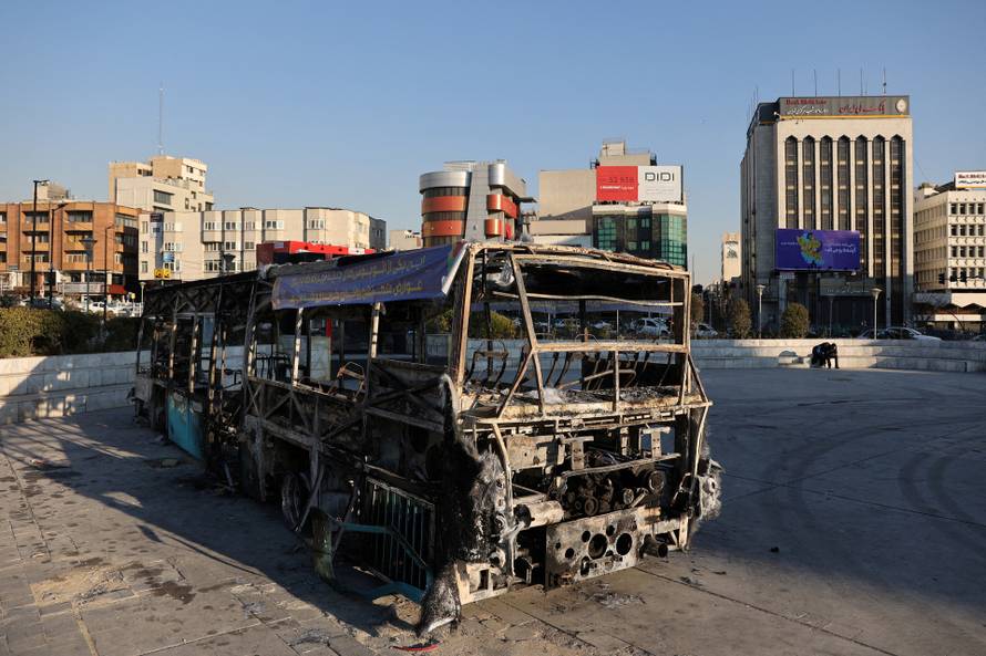FILE PHOTO: Bus burned during Iranian protests, on a street in Tehran