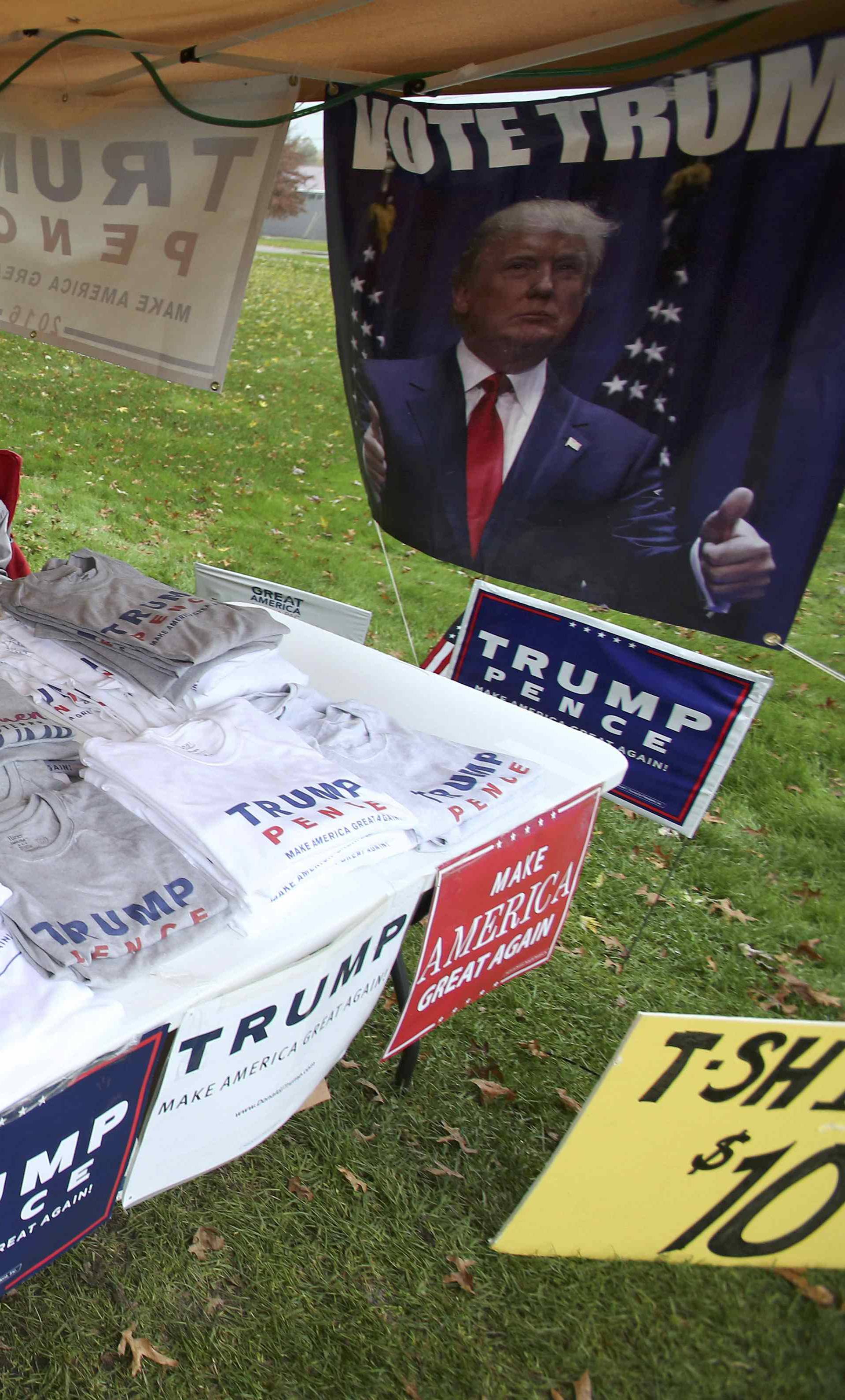 John Pinchak sits under his tent where he is giving away Donald Trump information and selling T-shirts  during the U.S. presidential election in Ohio