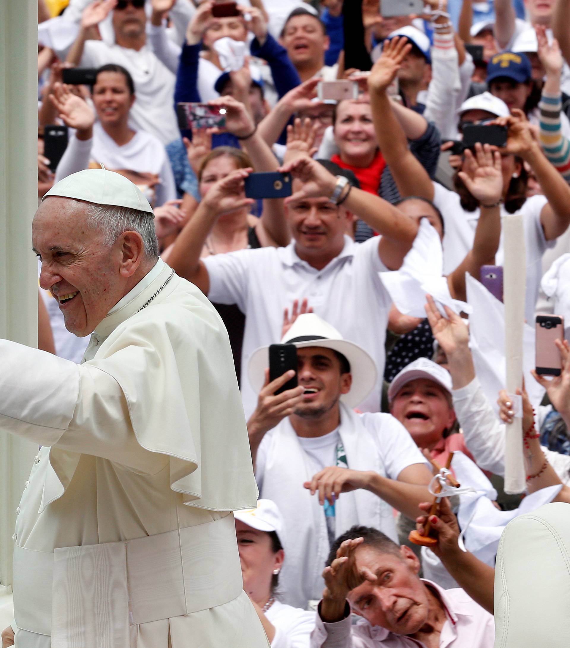 Pope Francis arrives on the popemobile for a holy mass at Enrique Olaya Herrera airport in Medellin