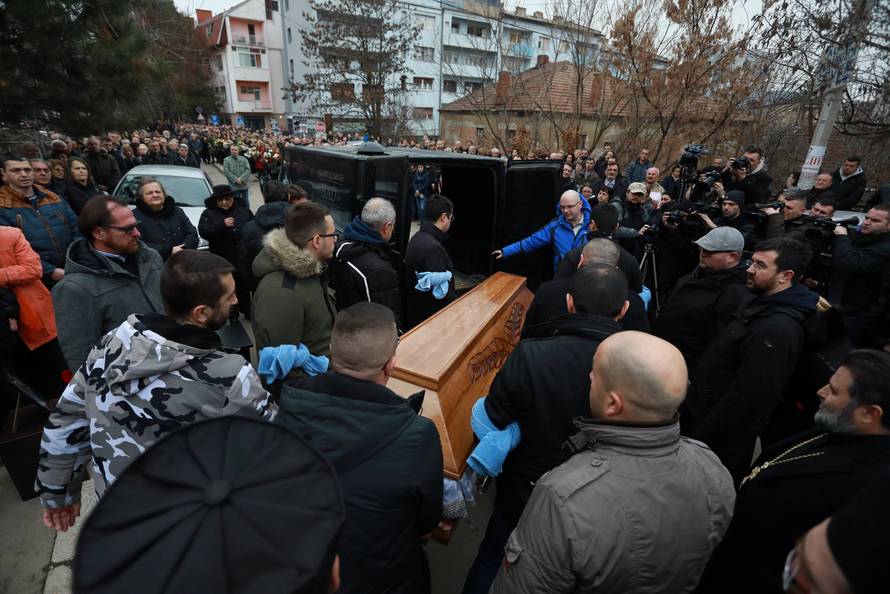 Men carry the coffin with the body of Oliver Ivanovic before a cortege travel to the northern outskirts of Kosovska Mitrovica