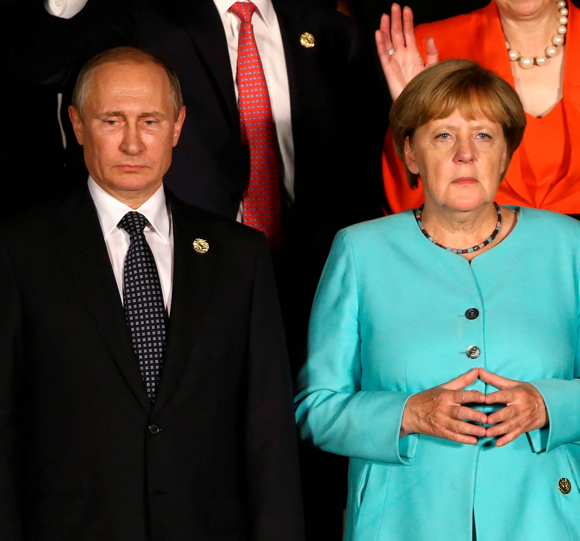 Russian President Vladimir Putin and German Chancellor Angela Merkel attend the G20 Summit in Hangzhou