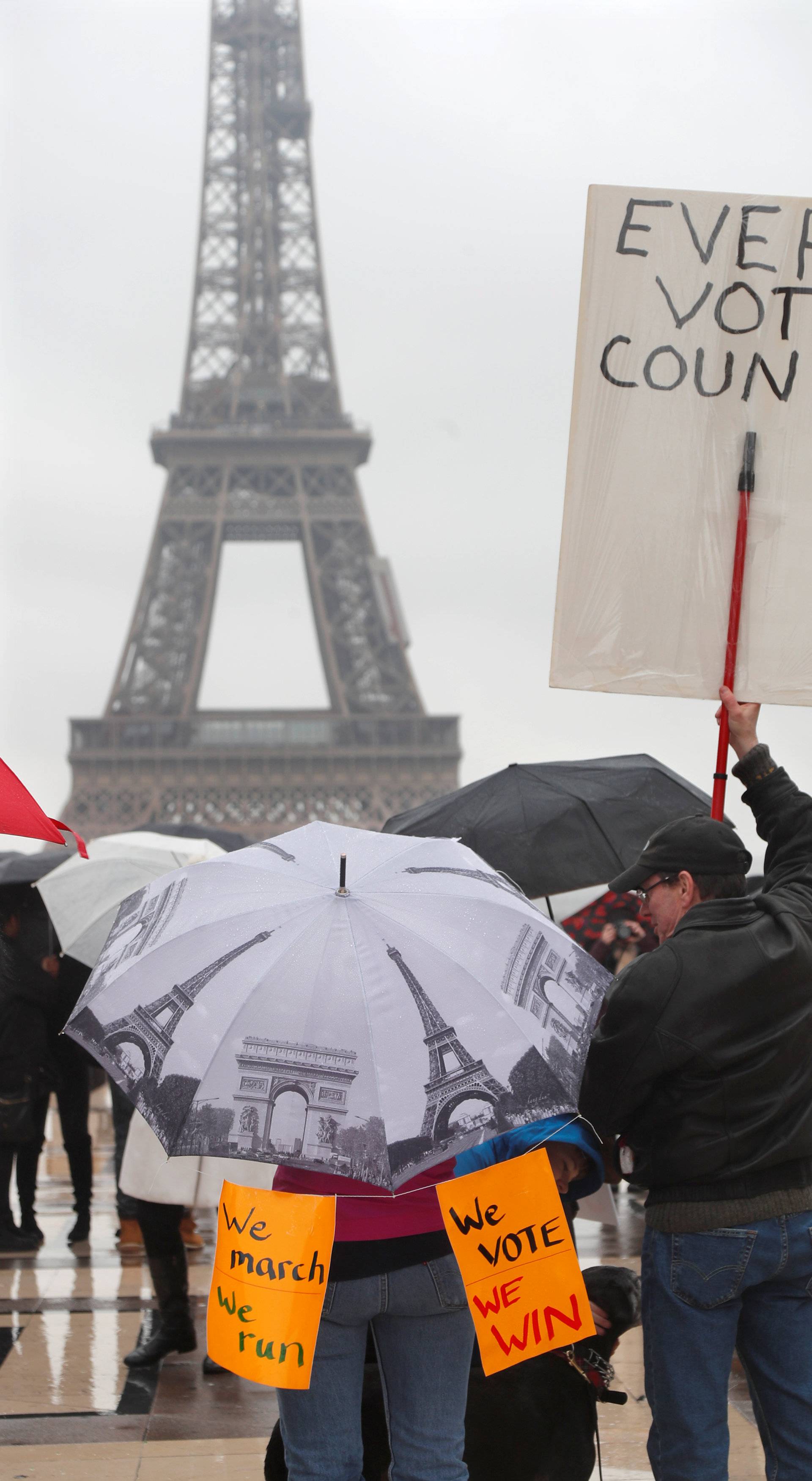 People gather at the Trocadero square near the Eiffel Tower to protest against U.S. President Donald Trump and for equal rights in Paris