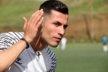 Biwar Abdullah, 25, an Iraqi Kurdish local footballer, who looks like the football player Cristiano Ronaldo, is seen at a football yard in the district of Soran, northeast of Erbil