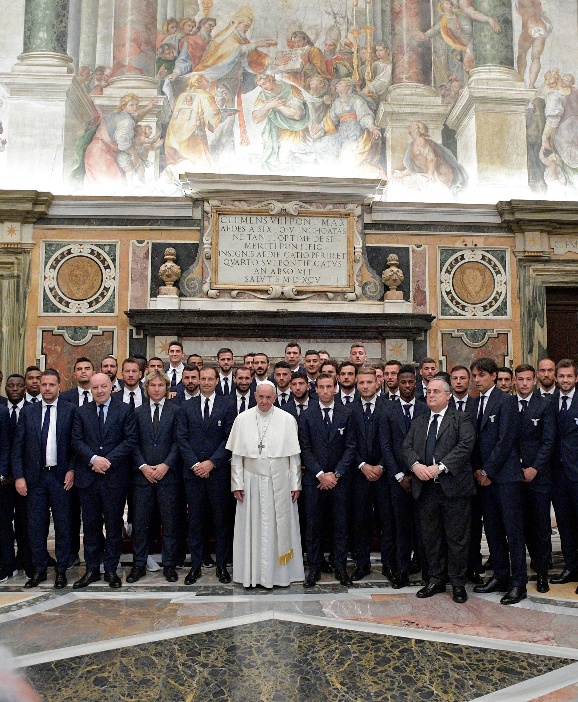 Pope Francis poses with Lazio and Juventus soccer teams during a private audience at the Vatican