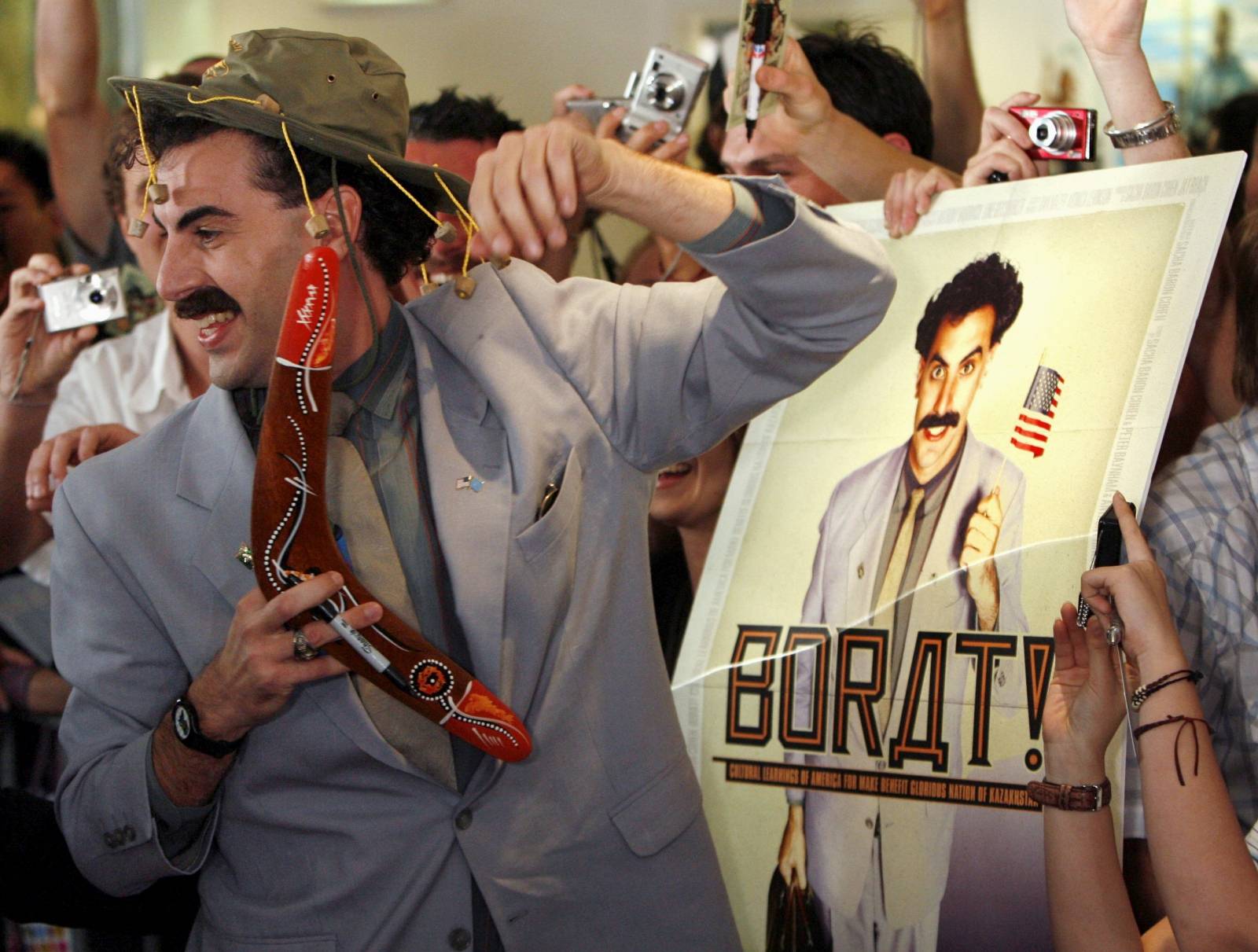 FILE PHOTO: British actor Sacha Baron Cohen, in character as a Kazakh TV reporter known as 'Borat', holds a boomerang as he mingles with fans at his film's premiere in Sydney
