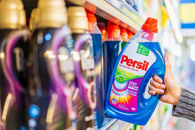 The customer takes liquid laundry detergent from the shelf. October 11, 2022 Balti Moldova