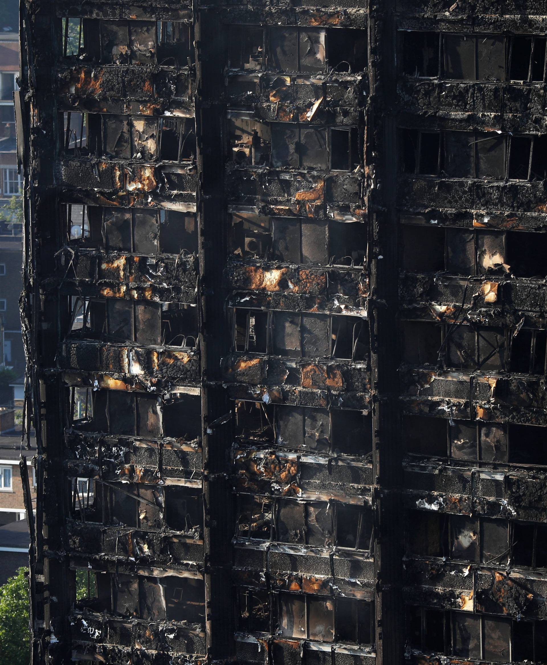Damage is seen to a tower block which was destroyed in a fire disaster, in north Kensington, West London