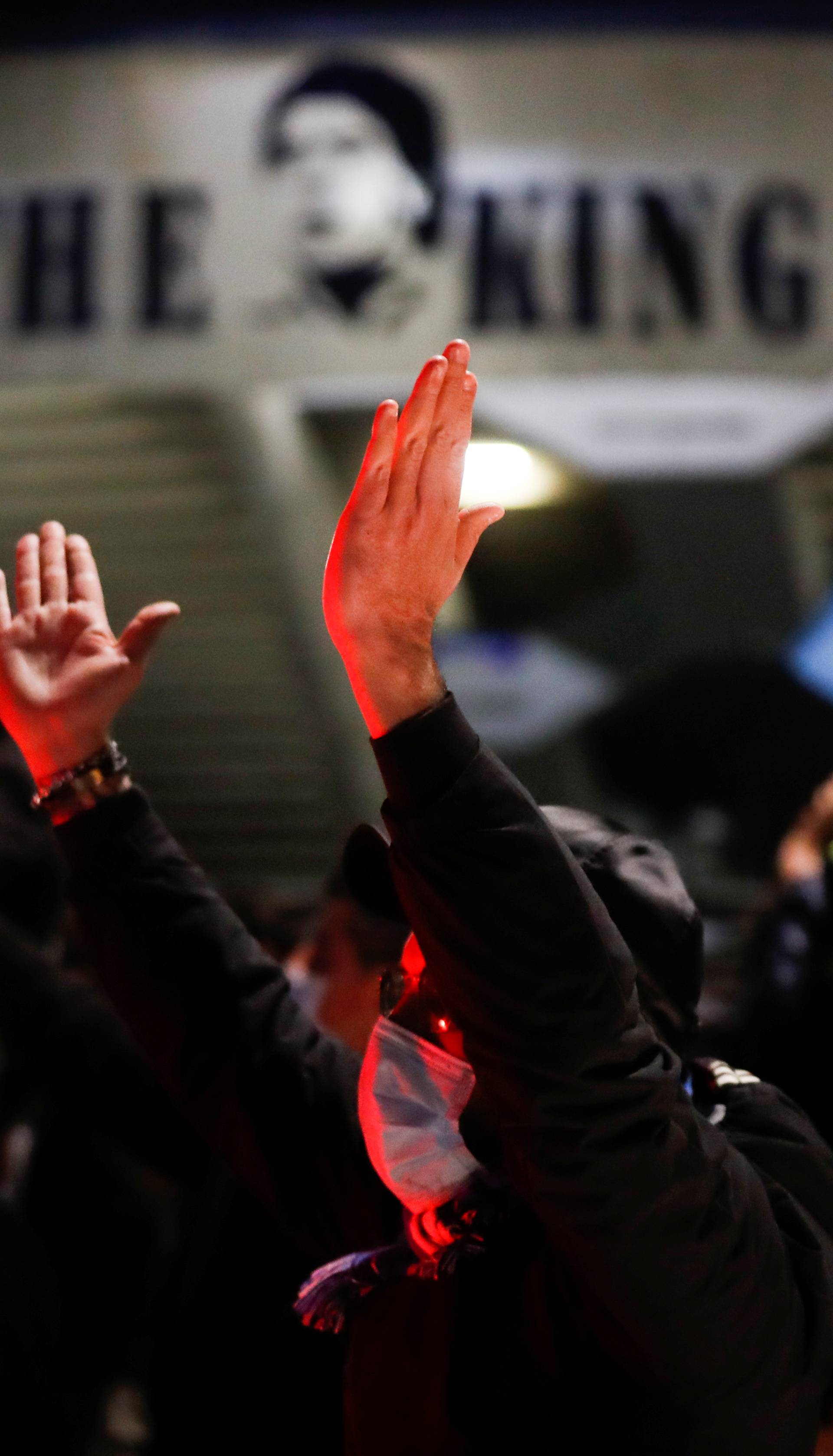 People gather to mourn the death of Argentine soccer legend Diego Maradona, in Naples