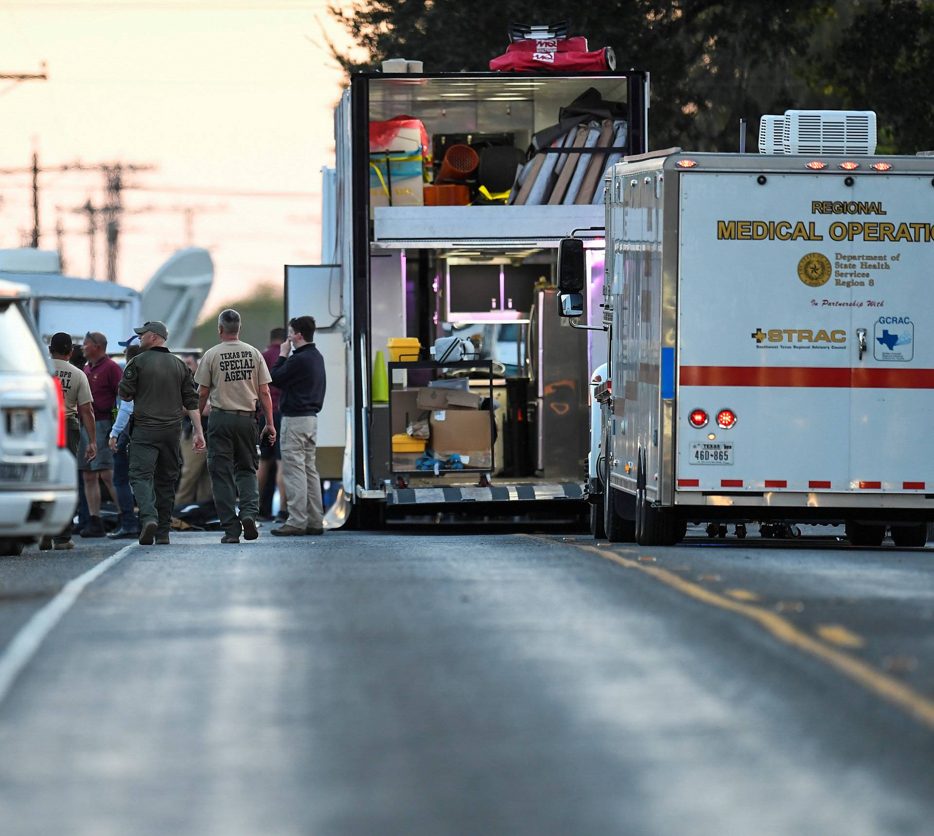 Medical personnel and law enforcement set up along a street near the First Baptist Church in Sutherland Springs, Texas