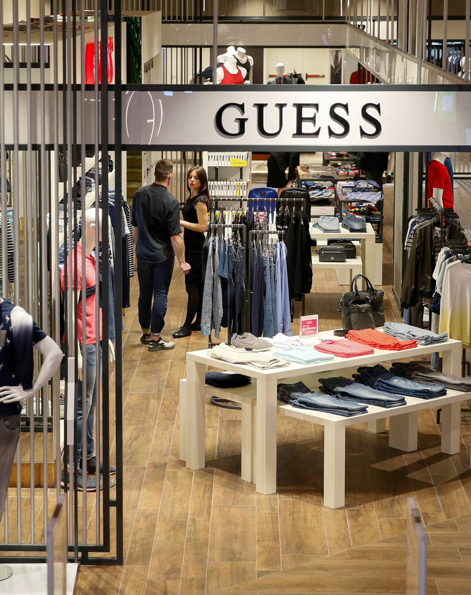 FILE PHOTO: Employees wait for customers in the Guess section in the Central Universal Department Store (TsUM) in Kiev