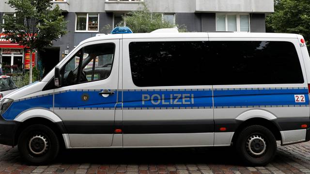 German police car is pictured during a raid in an apartment building at Kreuzberg district in Berlin