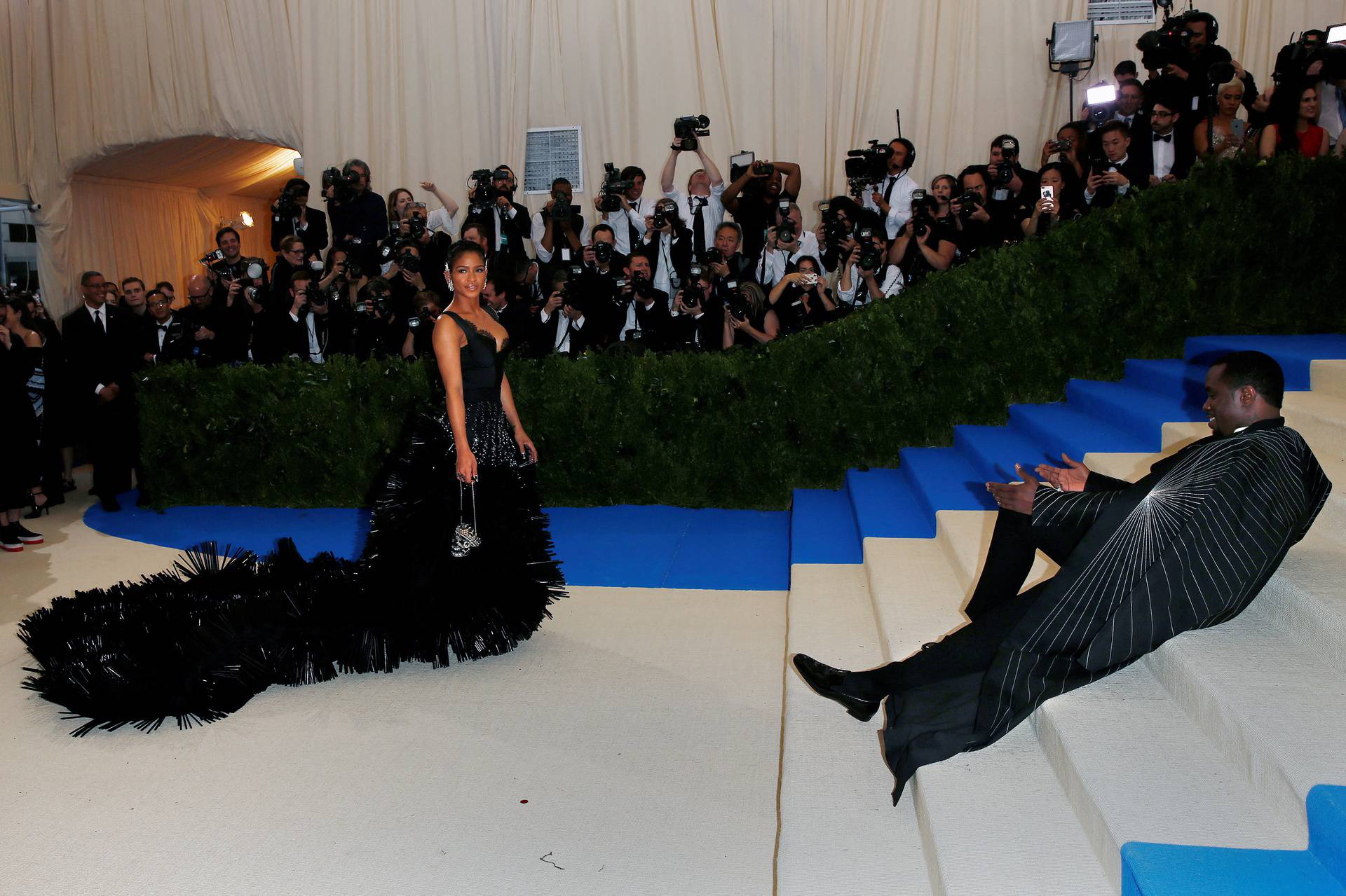 FILE PHOTO: Cassie Ventura poses for photographers as her boyfriend Sean "Diddy" Coombs lays on the stairs during the arrivals of the Metropolitan Museum of Art Costume Institute Gala - Rei Kawakubo/Comme des Garcons: Art of the In-Between in New York