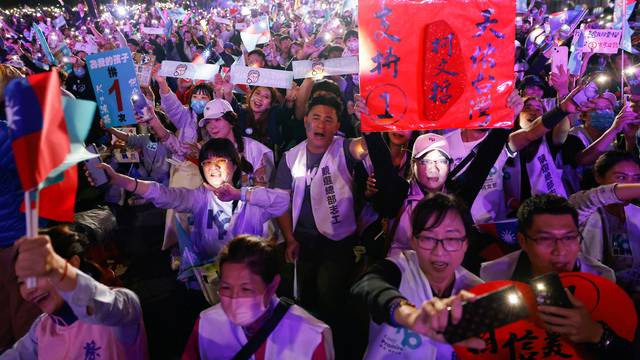 Supporters of Ko Wen-je, Taiwan People's Party (TPP) presidential candidate, attend a campaign event ahead of the election in Kaohsiung