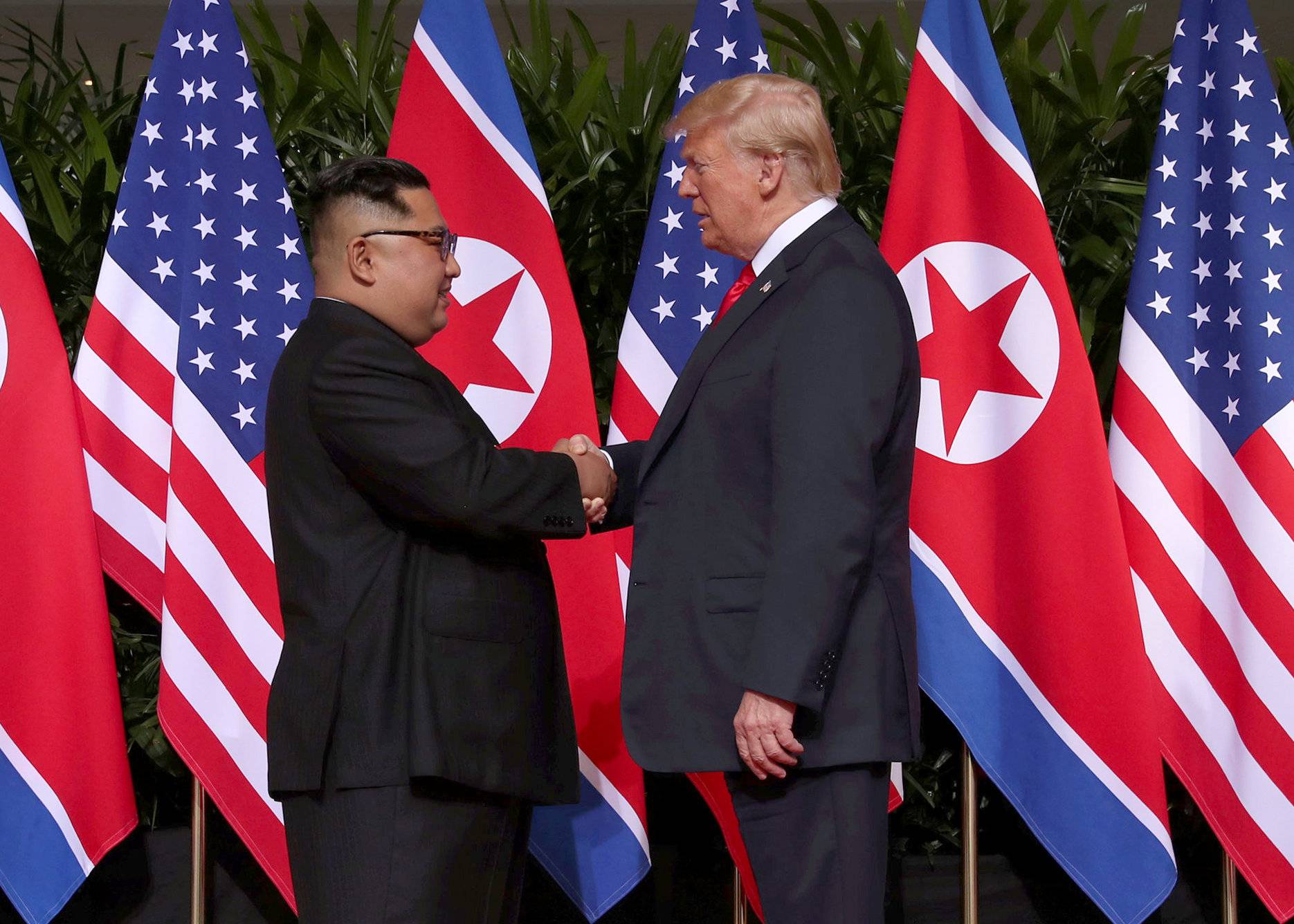 U.S. President Donald Trump shakes hands with North Korean leader Kim Jong Un at the Capella Hotel on Sentosa island in Singapore