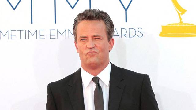 FILE PHOTO: Actor Matthew Perry arrives at the 64th Primetime Emmy Awards in Los Angeles