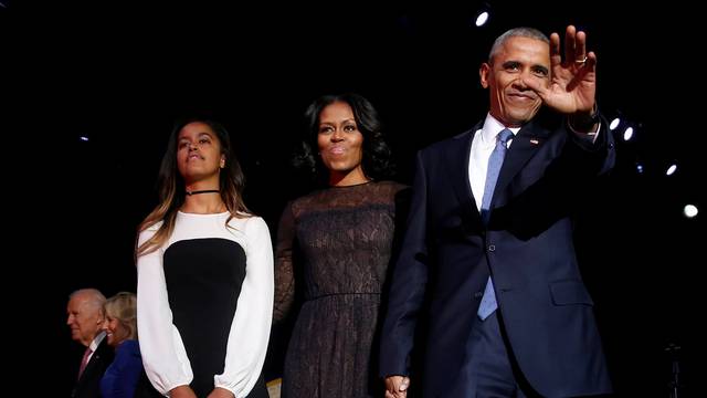 U.S. President Barack Obama is joined onstage by first lady Michelle Obama, Vice President Joe Biden and his wife Jill Biden, after his farewell address in Chicago