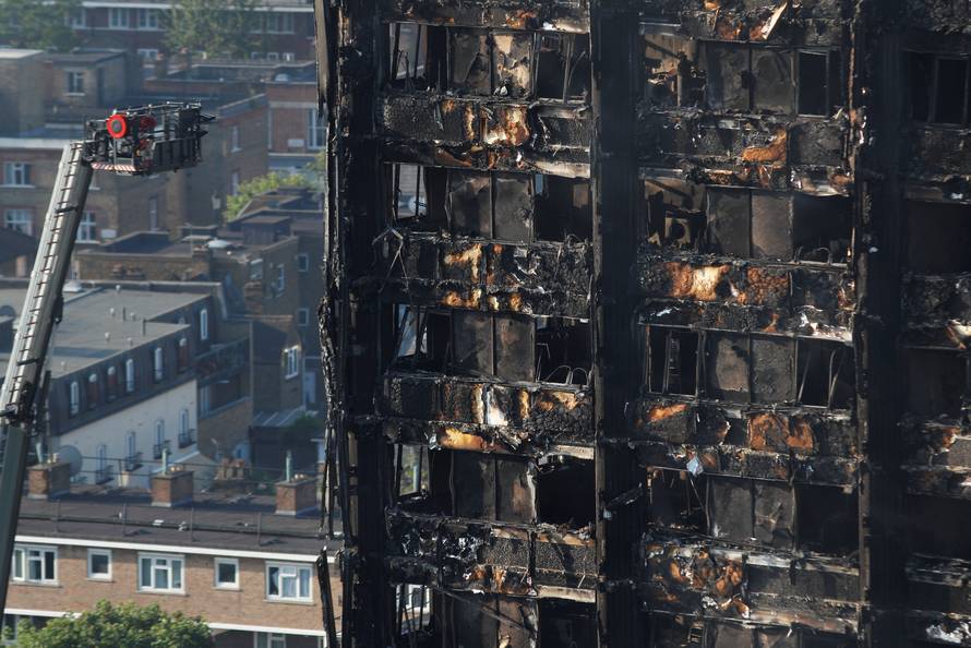 Damage is seen to a tower block which was destroyed in a fire disaster, in north Kensington, West London