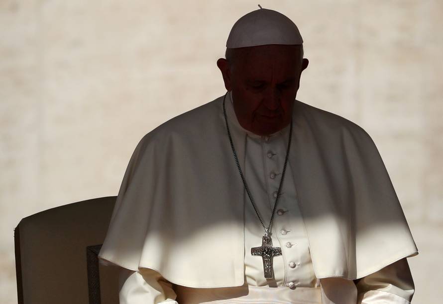 FILE PHOTO: Pope Francis arrives to lead the Wednesday general audience in Saint Peter's square at the Vatican