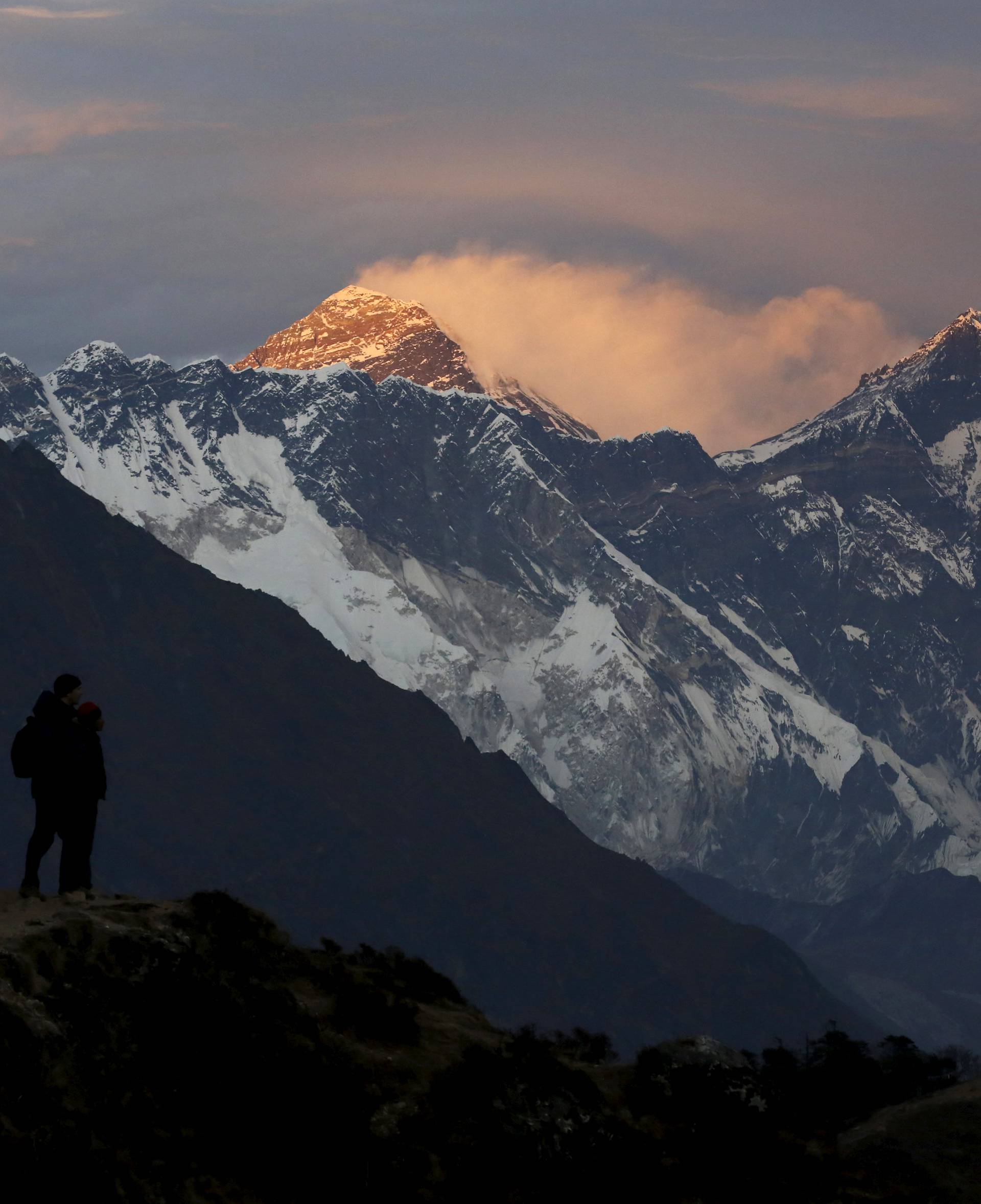 Light illuminates Mount Everest during sunset in Solukhumbu district also known as the Everest region