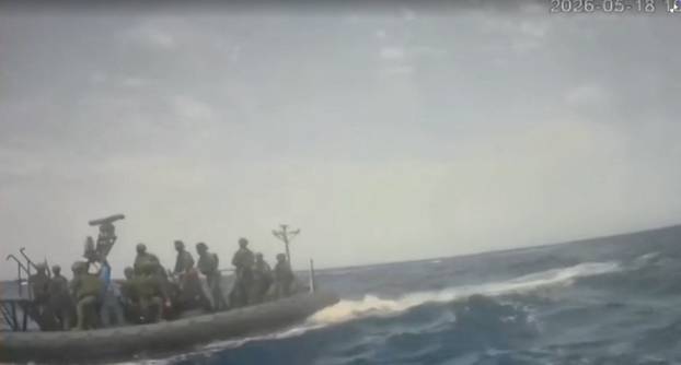 An Israeli naval boat intercepts the Global Sumud Flotilla en route to Gaza, in an attempt to deliver aid, at sea