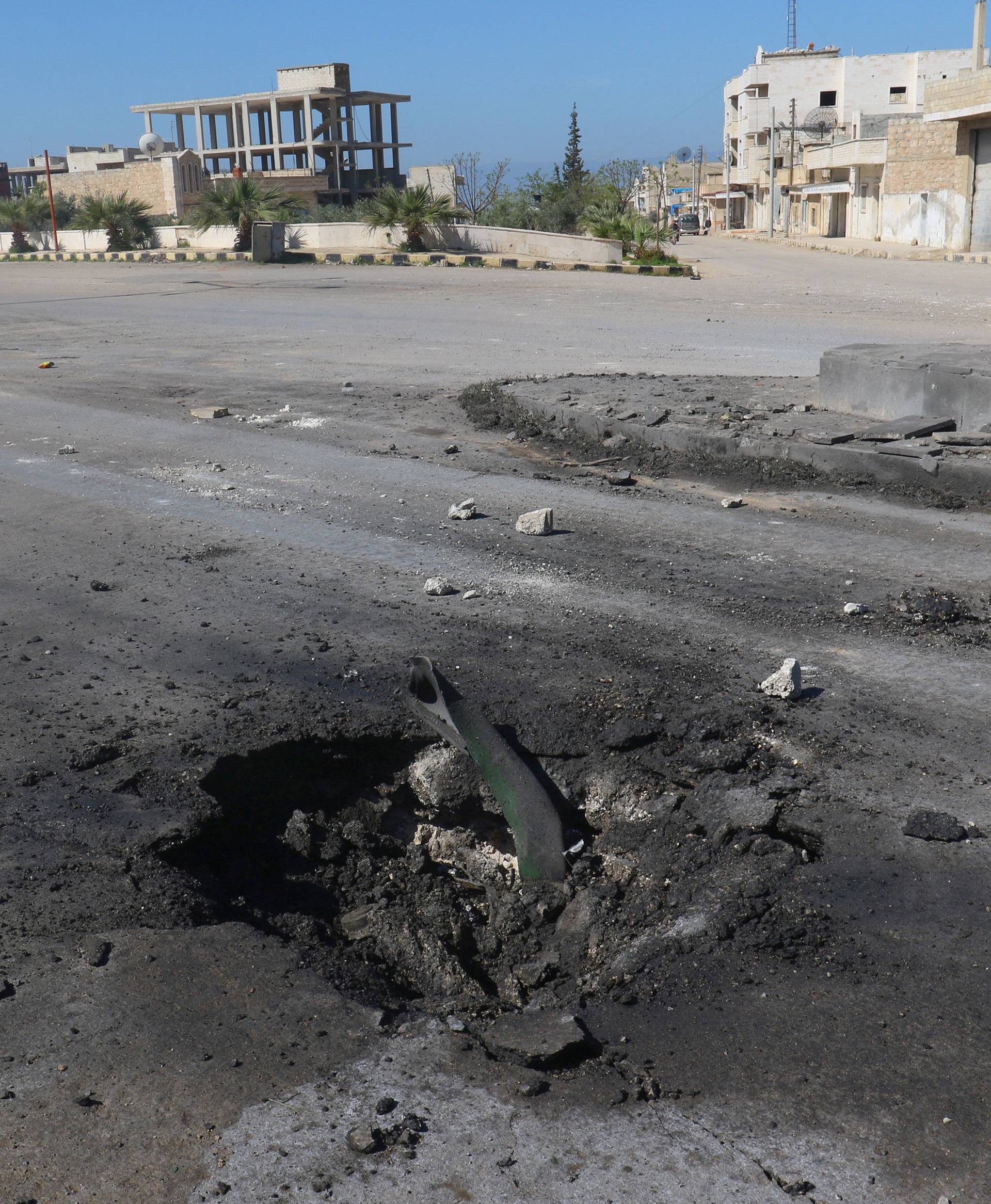 A crater is seen at the site of an airstrike, after what rescue workers described as a suspected gas attack in the town of Khan Sheikhoun in rebel-held Idlib