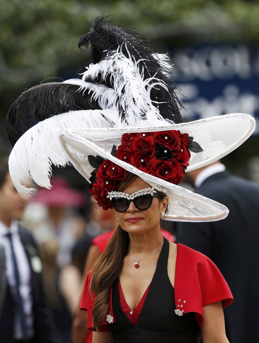 Britain Horse Racing Ladies Day Racegoer wears hat