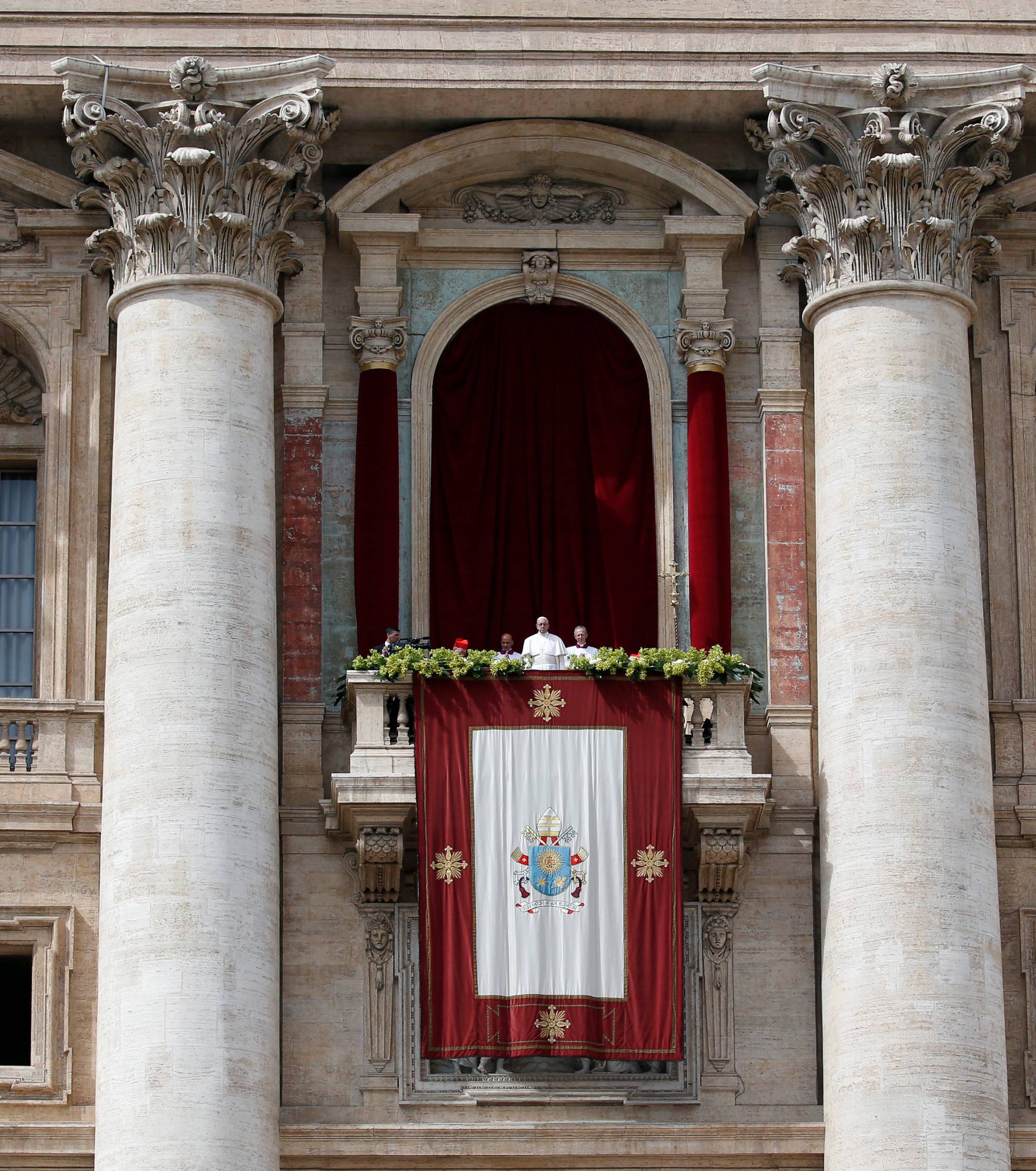 Pope Francis delivers his Easter message in the Urbi et Orbi (to the city and the world) address from the balcony overlooking St. Peter's Square at the Vatican