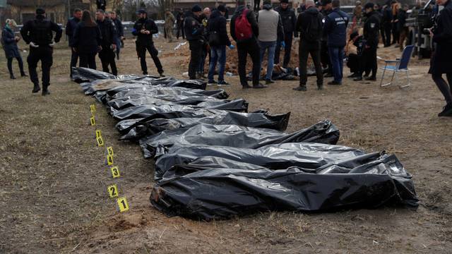 Exhumation of bodies of civilians from a mass grave in Bucha