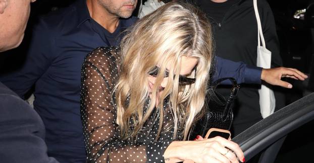 Kate Moss needs assistance leaving dinner after a night out