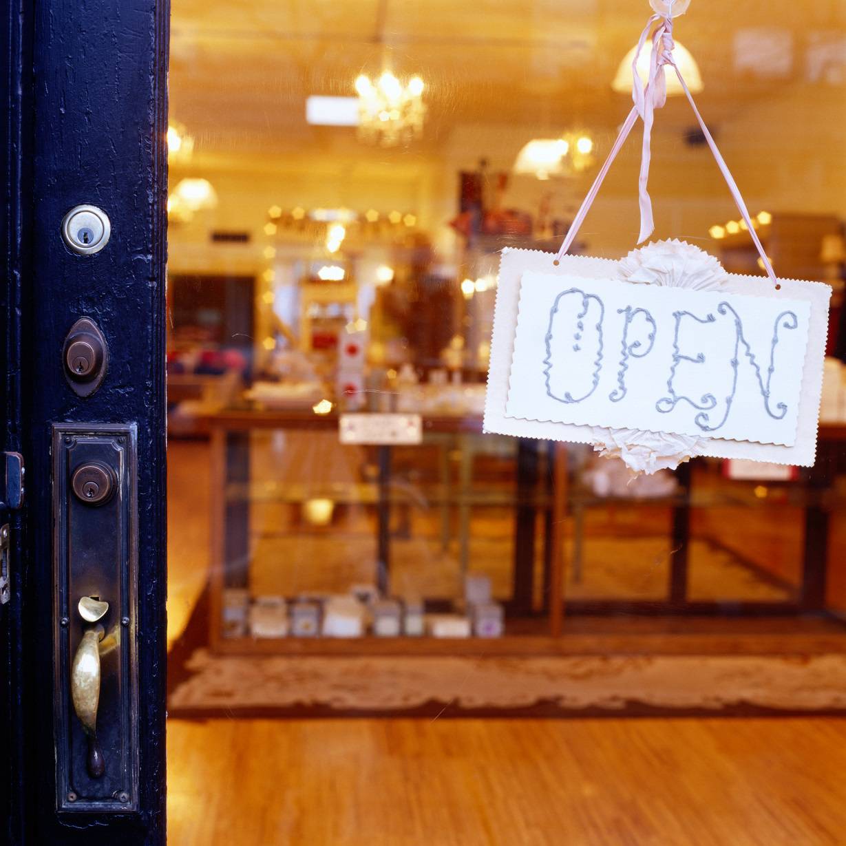 Open sign hanging on store door