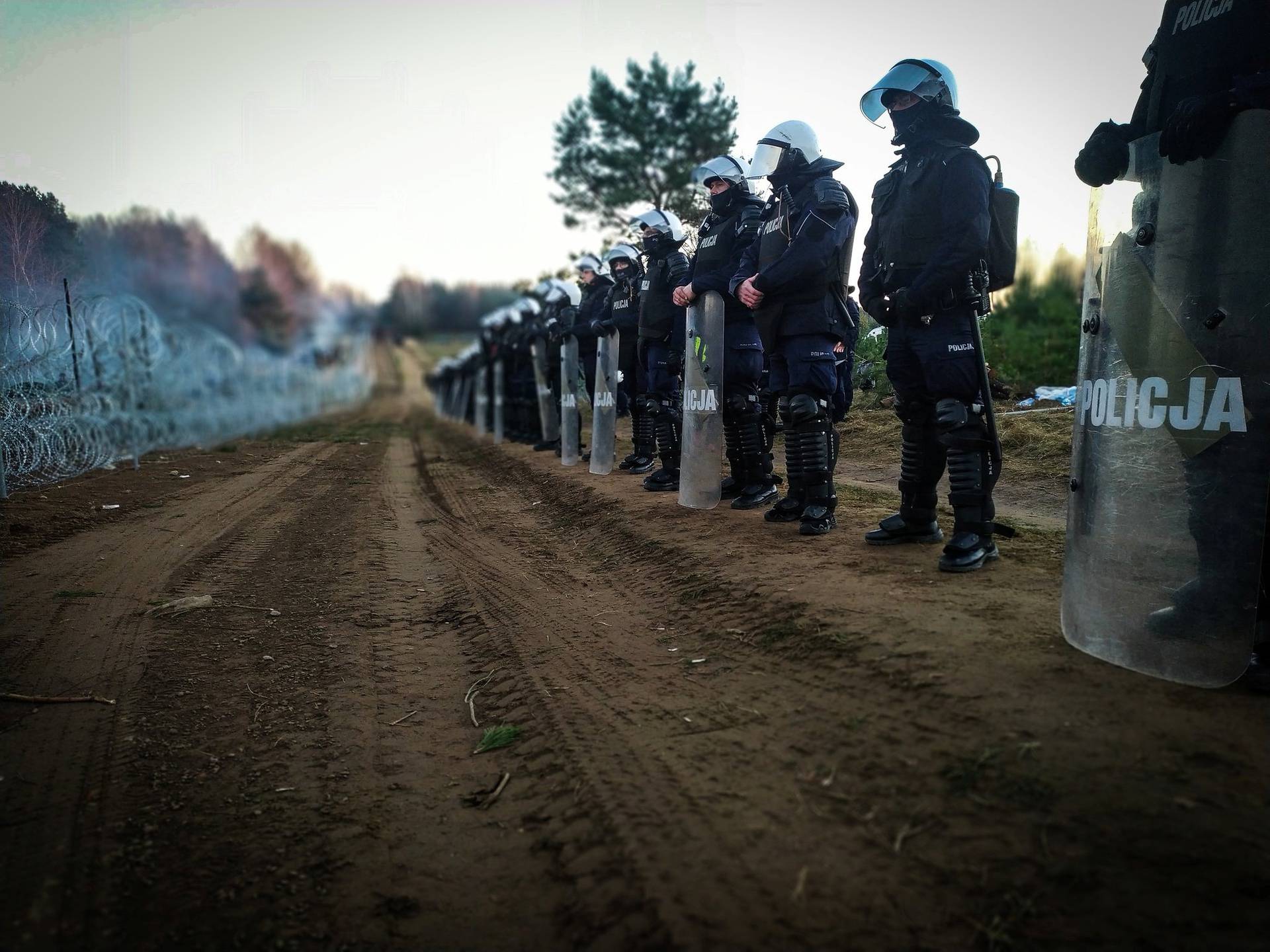 Polish police guard border fence on the Poland/Belarus border near Kuznica