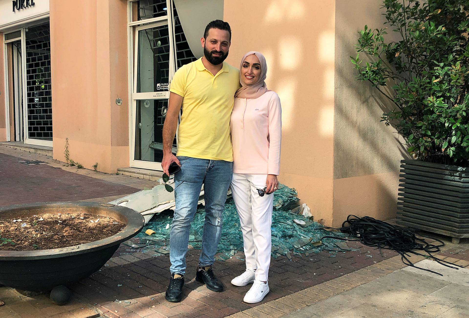 Bride Israa Seblani poses for a picture with her husband Ahmad Subeih in Beirut