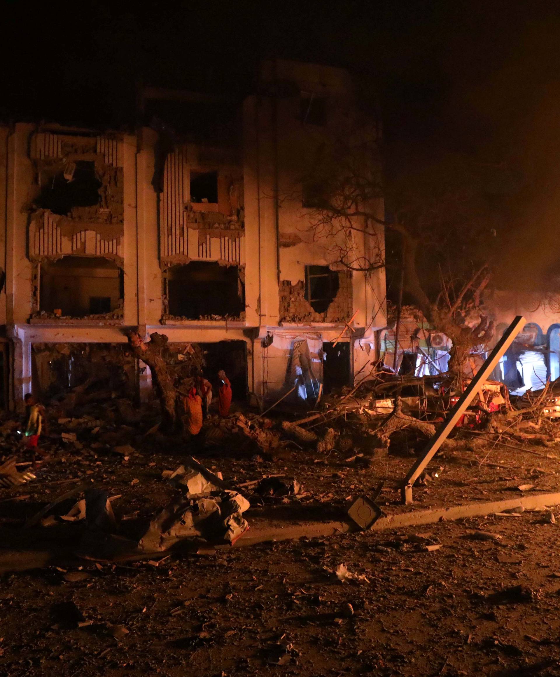 Flames are burning at the scene where a suicide car bomb exploded targeting a Mogadishu hotel in a business center in Maka Al Mukaram street in Mogadishu