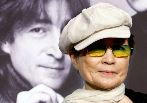 FILE PHOTO: John Lennon's wife Yoko Ono listens to reporter's questions in Tokyo