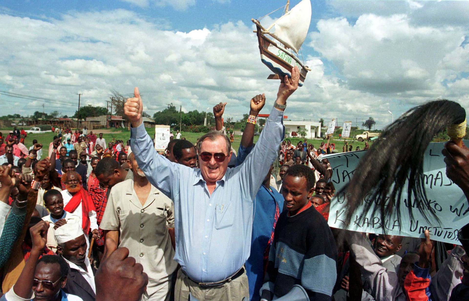 FILE PHOTO: Secretary General of the "Safina" party (Ark Party) Richard Leakey holds up mini ark as he waves to ..