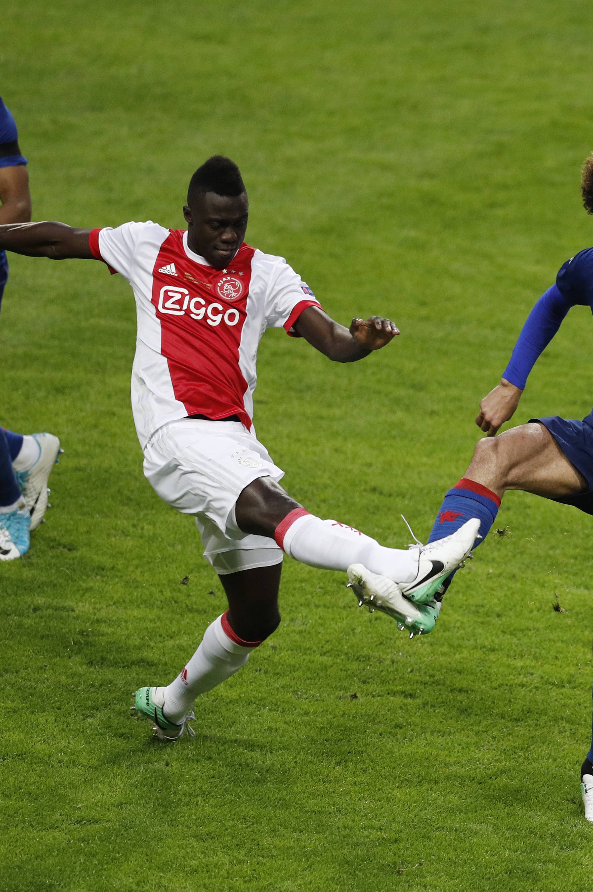 Ajax's Bertrand Traore in action with Manchester United's Marouane Fellaini