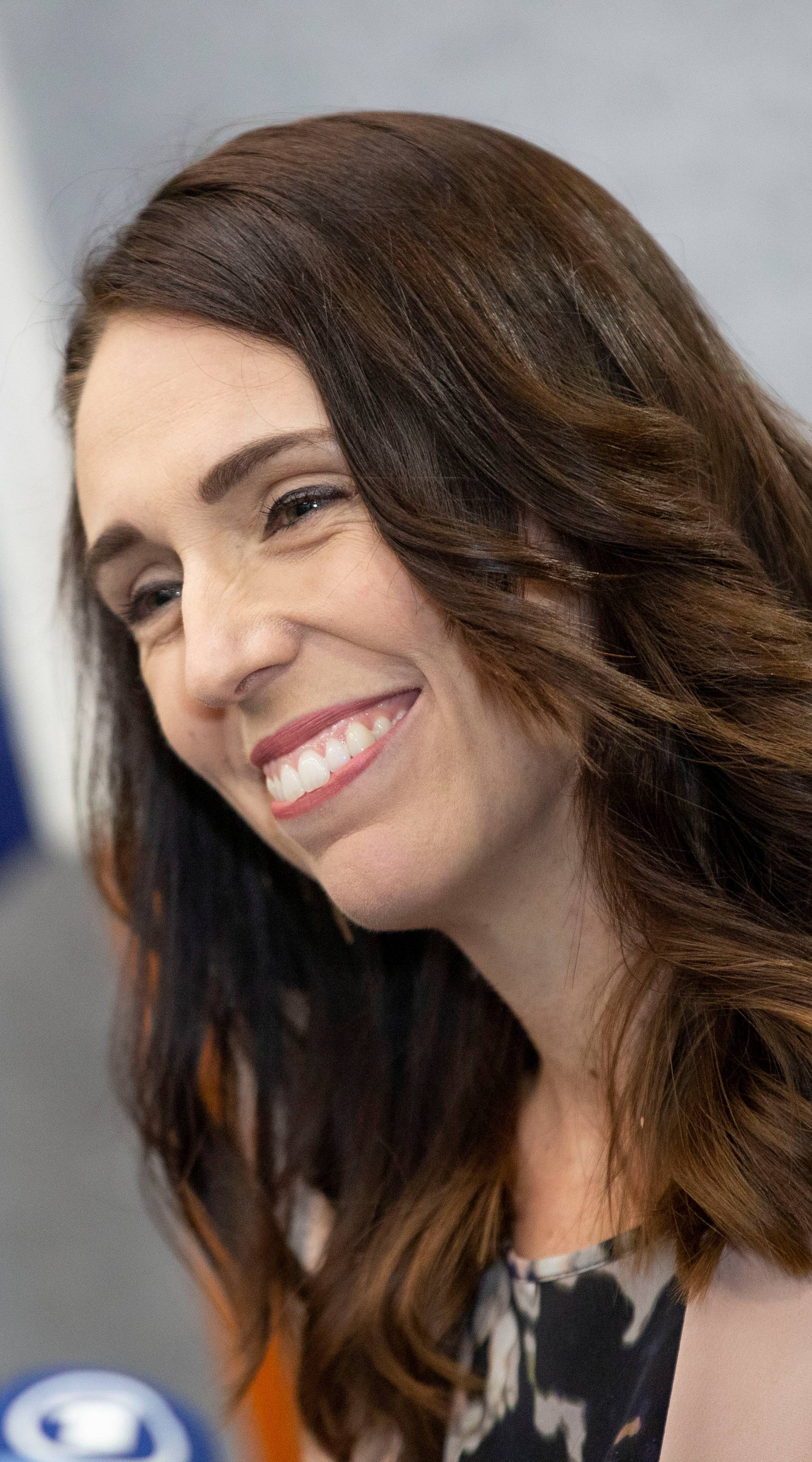 New Zealand Prime Minister Jacinda Ardern smiles during a news conference prior to the anniversary of the mosque attacks that took place the prior year in Christchurch