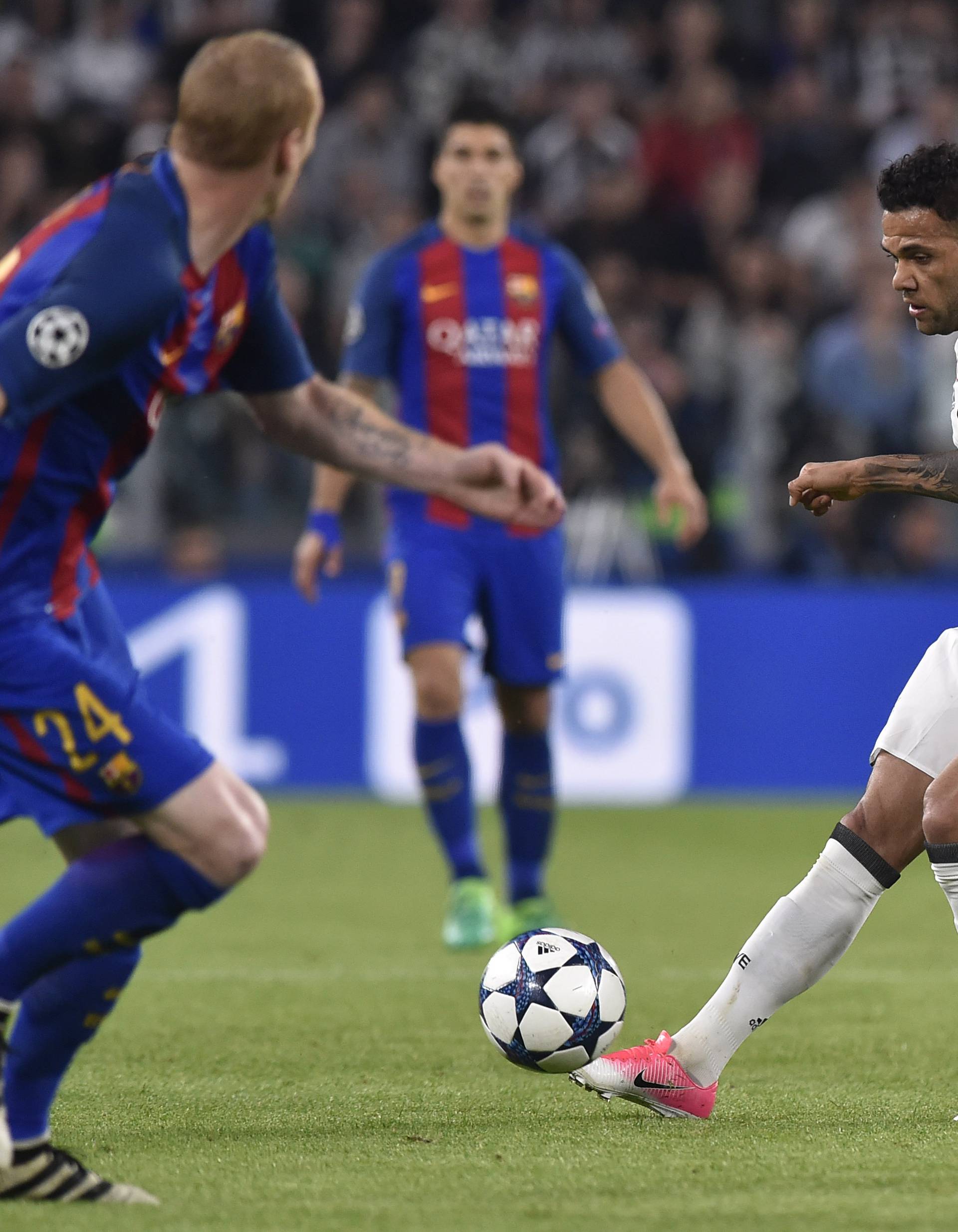 Juventus' Dani Alves in action with Barcelona's Javier Mascherano