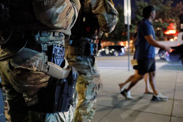 Members of the Ohio National Guard wear their sidearms while patrolling in Washington