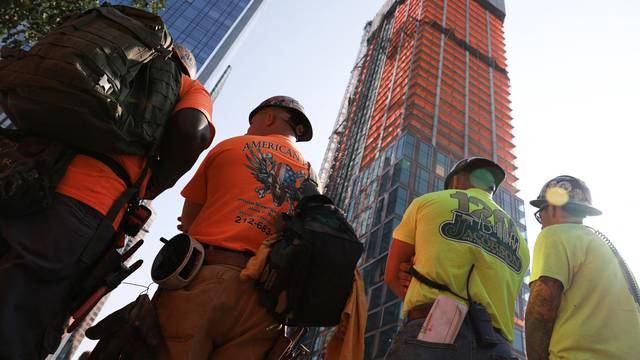 A construction crane catches fire on a high-rise building, in New York