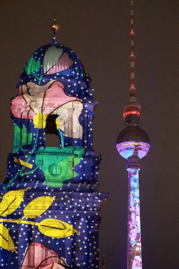 The Berlin Cathedral (Berliner Dom) and the Berlin TV Tower are illuminated during the Festival of Lights in Berlin