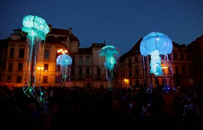 Artists perform during a street theater festival in Prague